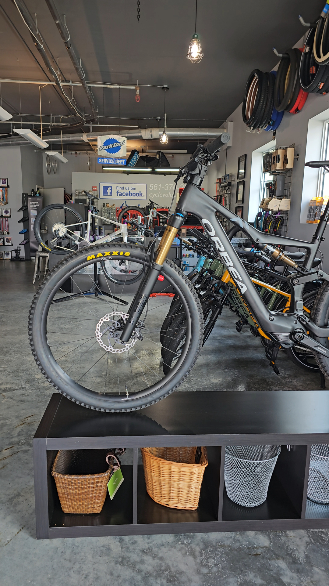 Orbea full-suspension mountain bike on display inside the Cyclevolution shop